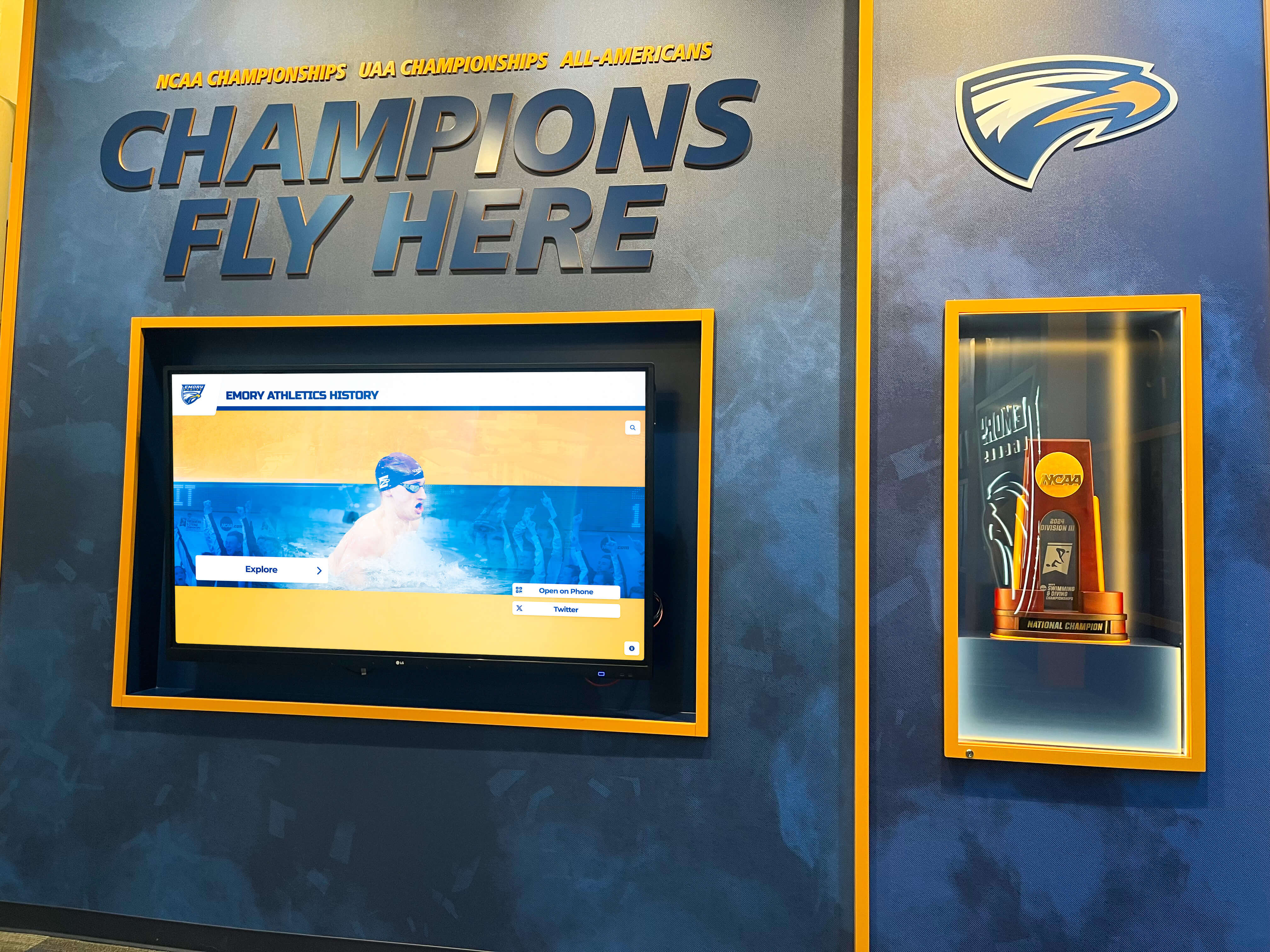 Championship wall celebrating team achievements and trophies Team championship display