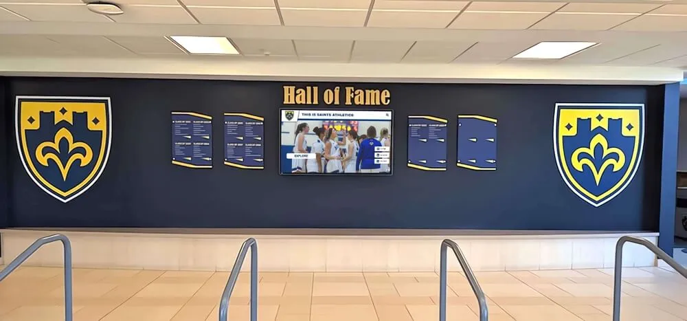 Wall display featuring shields and digital screen Recognition display wall