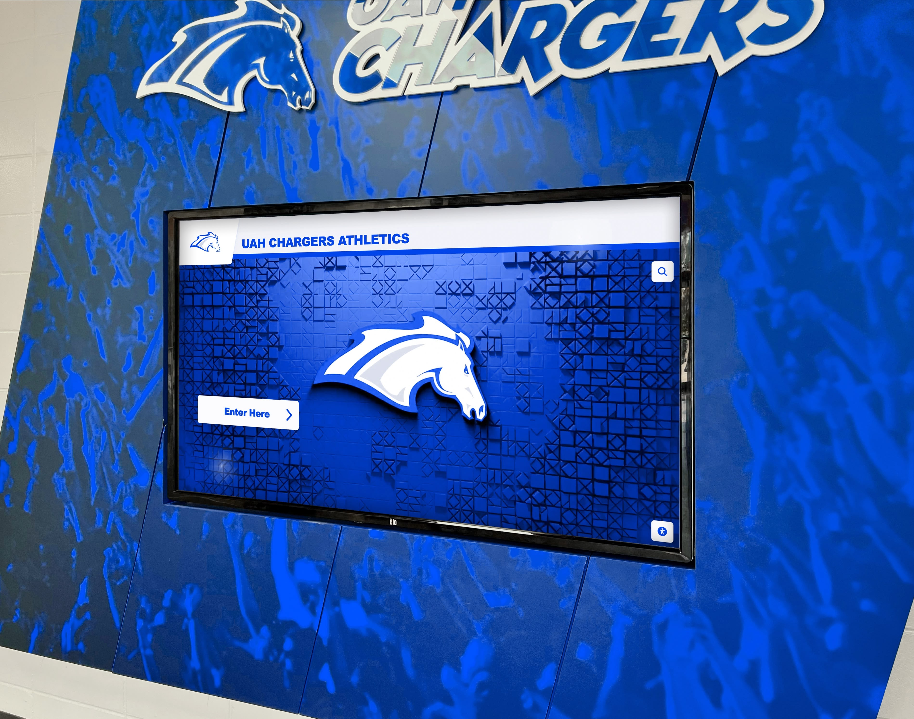 UAH Chargers athletics digital screen on blue wall